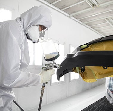 Collision Center Technician Painting a Vehicle | Crown Toyota in Ontario CA